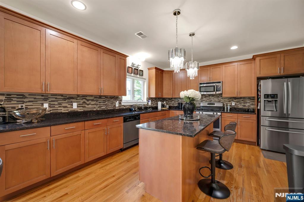 6 Jacob Way Phillipsburg, NJ 08865 - Photo 13 of 38 a kitchen with stainless steel appliances granite countertop a sink refrigerator and cabinets