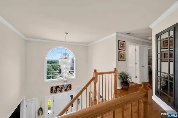 a view of an entryway with wooden floor and windows