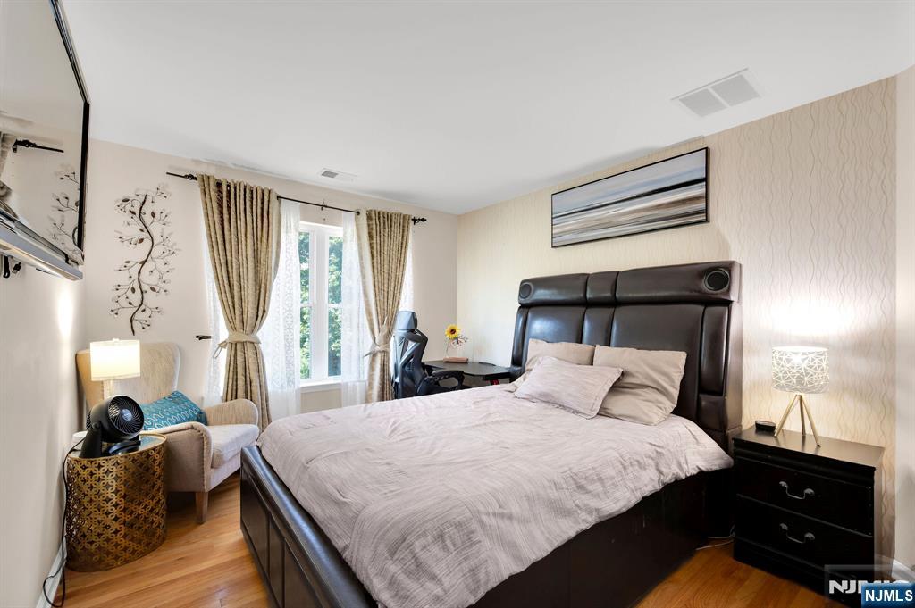 6 Jacob Way Phillipsburg, NJ 08865 - Photo 22 of 38 a bedroom with a bed and a night stand