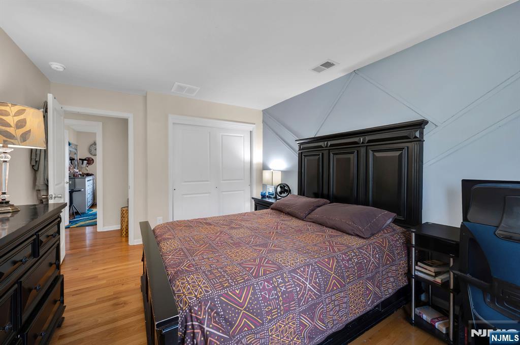 6 Jacob Way Phillipsburg, NJ 08865 - Photo 25 of 38 a bedroom with a bed and a mirror on dresser