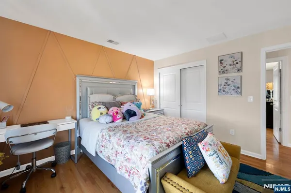 a bedroom with a bed and a table in it