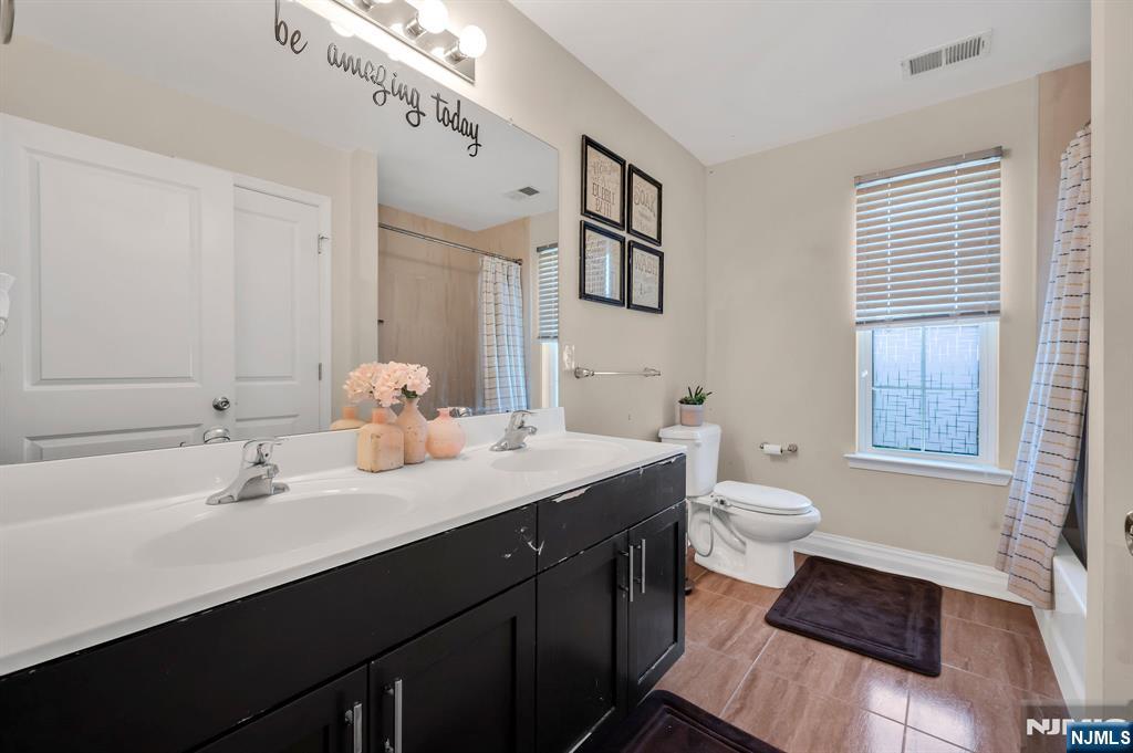 6 Jacob Way Phillipsburg, NJ 08865 - Photo 28 of 38 a bathroom with a sink and a mirror