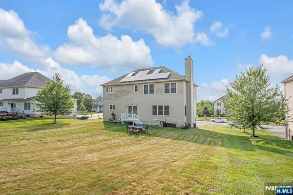 a view of a house with a yard porch and sitting area