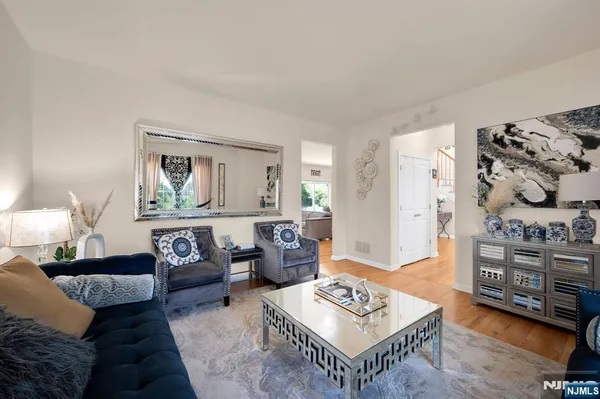 a living room with furniture and a table