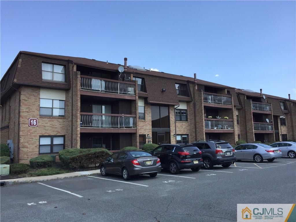 1623 Raspberry Court, Unit 1623 Edison, NJ 08817 - Photo 1 of 18 a car parked in front of a building