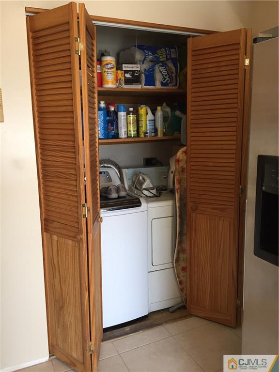 1623 Raspberry Court, Unit 1623 Edison, NJ 08817 - Photo 11 of 18 a storage room with washer and dryer
