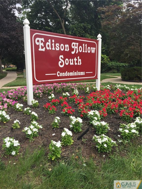 1623 Raspberry Court, Unit 1623 Edison, NJ 08817 - Photo 18 of 18 a sign that is sitting in front of flowers