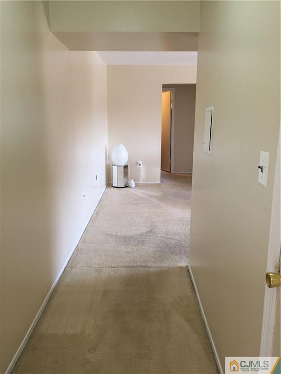 1623 Raspberry Court, Unit 1623 Edison, NJ 08817 - Photo 3 of 18 a view of a room with closet and mirror