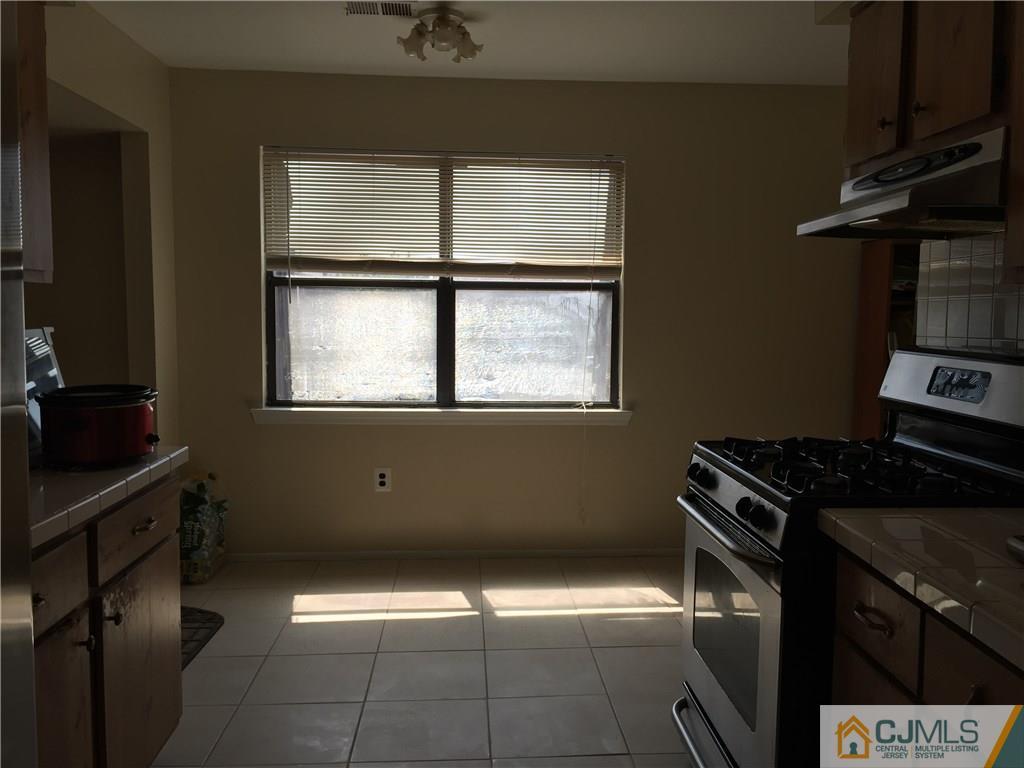 1623 Raspberry Court, Unit 1623 Edison, NJ 08817 - Photo 10 of 18 a view of a livingroom with wooden floor