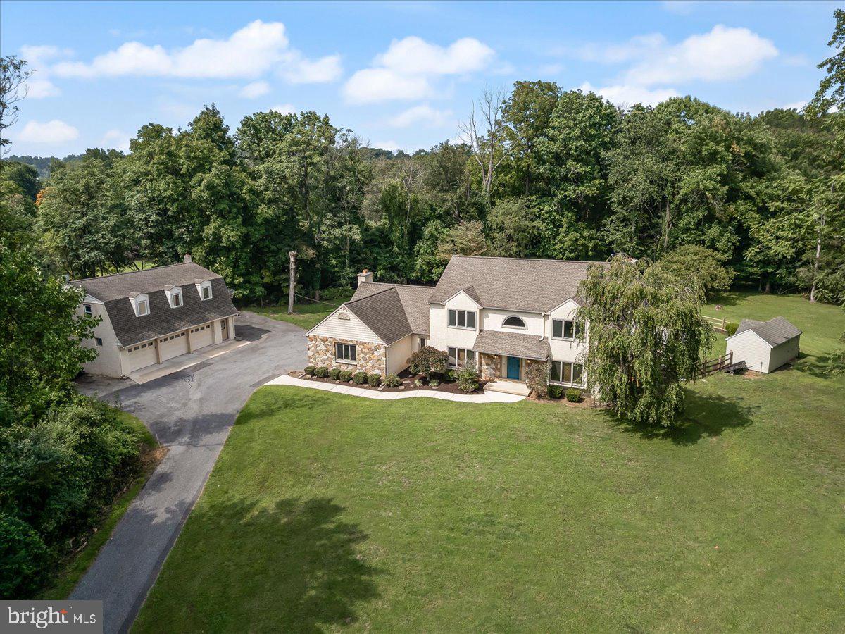 336 Howarth Road Media, PA 19063 - Photo 1 of 61 an aerial view of a house with swimming pool garden and patio