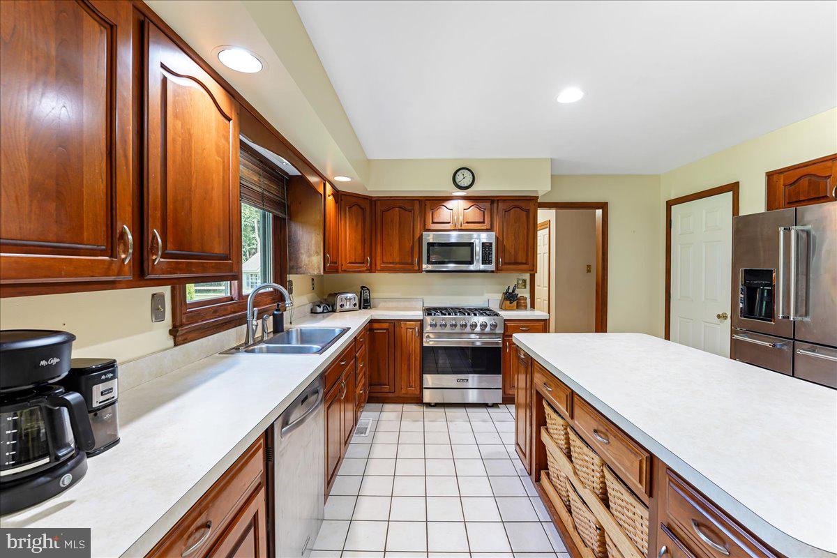 336 Howarth Road Media, PA 19063 - Photo 20 of 61 a large kitchen with stainless steel appliances granite countertop a sink and cabinets