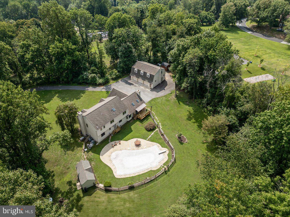 336 Howarth Road Media, PA 19063 - Photo 3 of 61 an aerial view of a house with a yard and large trees