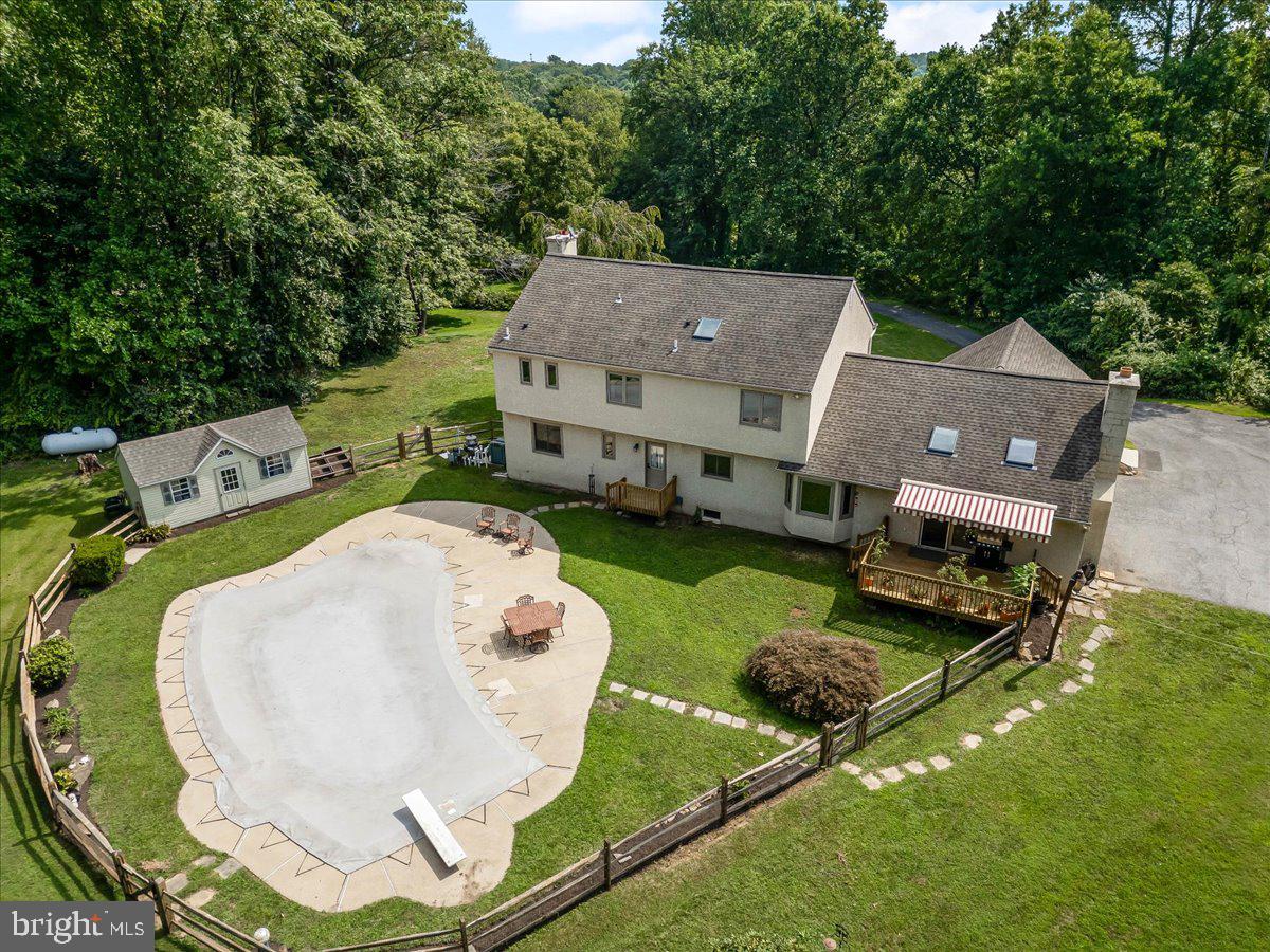 336 Howarth Road Media, PA 19063 - Photo 45 of 61 an aerial view of a house with swimming pool and large trees