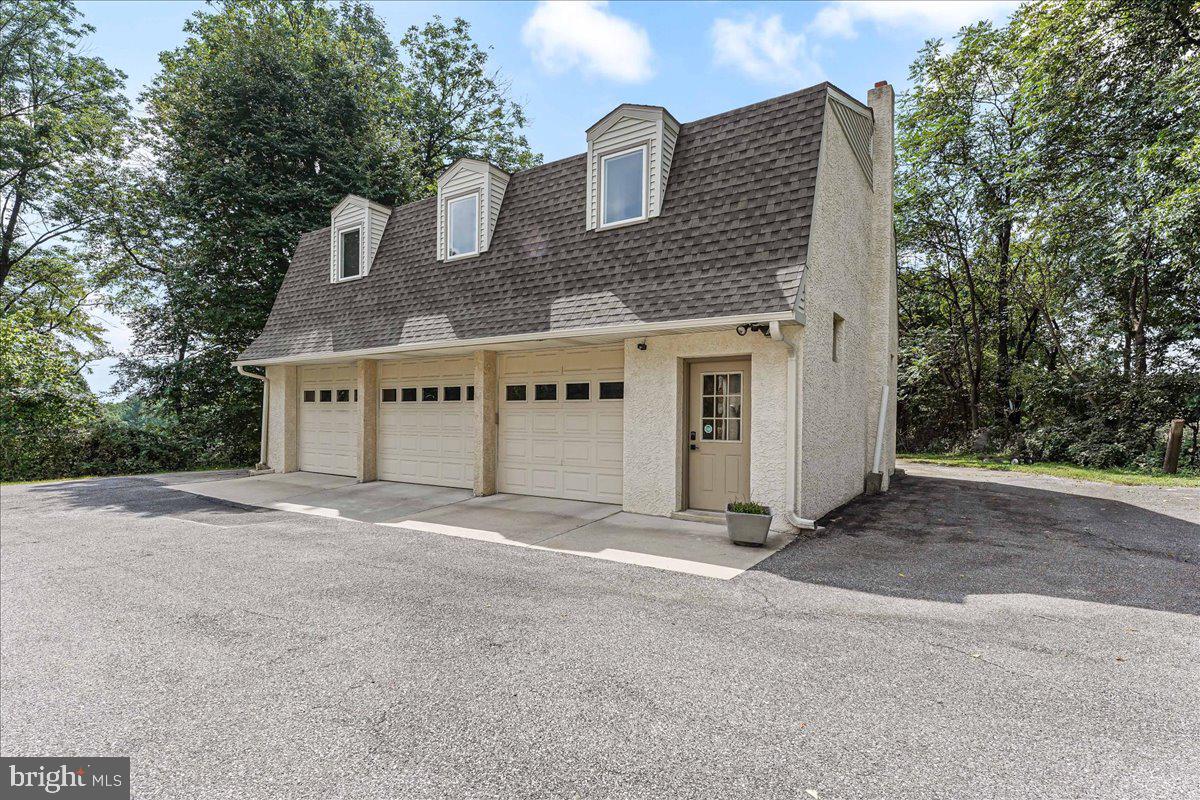 336 Howarth Road Media, PA 19063 - Photo 53 of 61 a front view of a house with garage