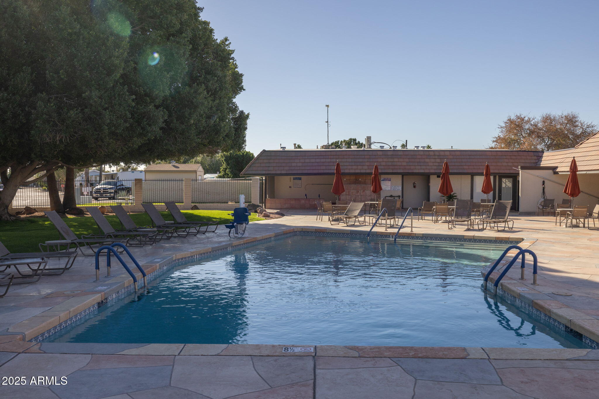 201 South Greenfield Road, Unit 310 Mesa, AZ 85206 - Photo 31 of 34 a view of swimming pool with outdoor seating and plants
