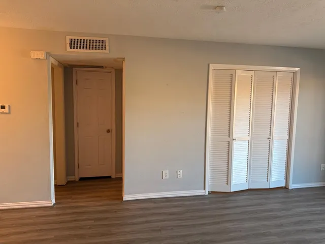 a view of a livingroom with wooden floor