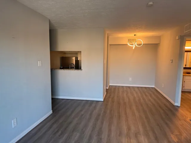 a view of a livingroom with wooden floor