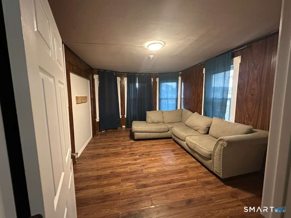43 Washington Terrace, Unit 2 Bridgeport, CT 06604 - Photo 8 of 8 a living room with furniture and a large window