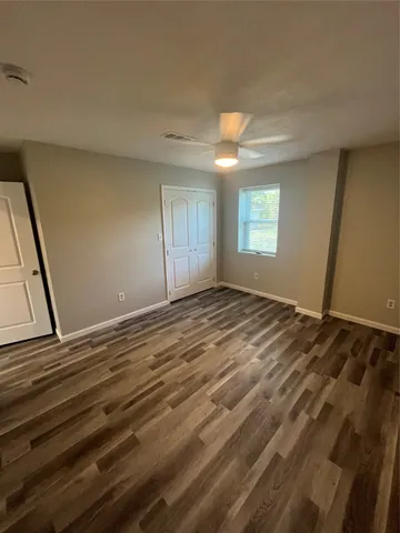 a view of room window and wooden floor