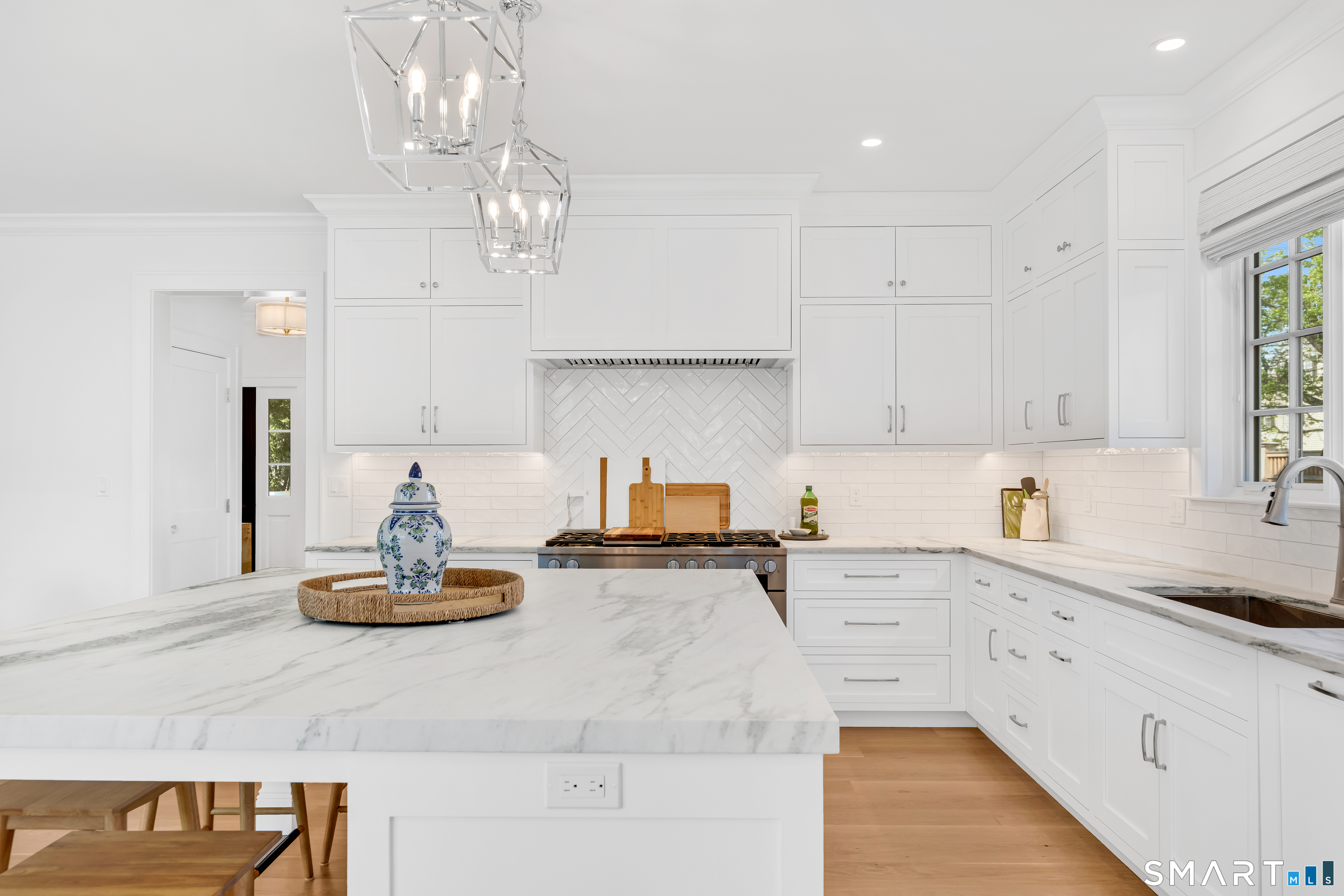920 Old Post Road Fairfield, CT 06824 - Photo 11 of 40 Honed marble countertops with inset door custom cabinetry