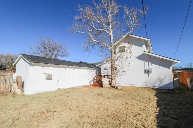 a view of a house with a snow in the yard