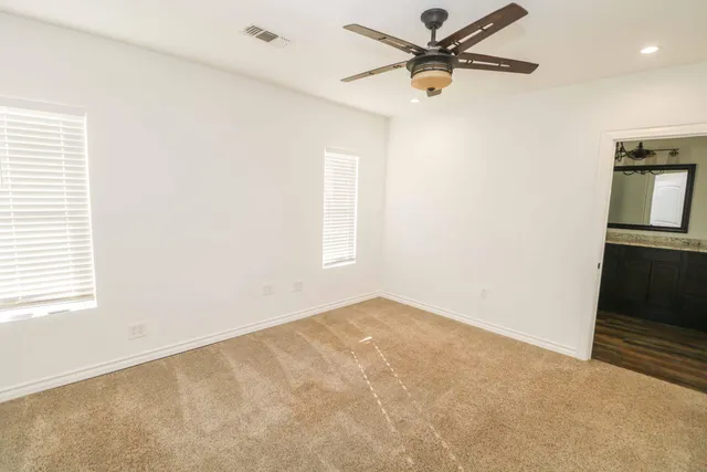 a view of a big room with carpet