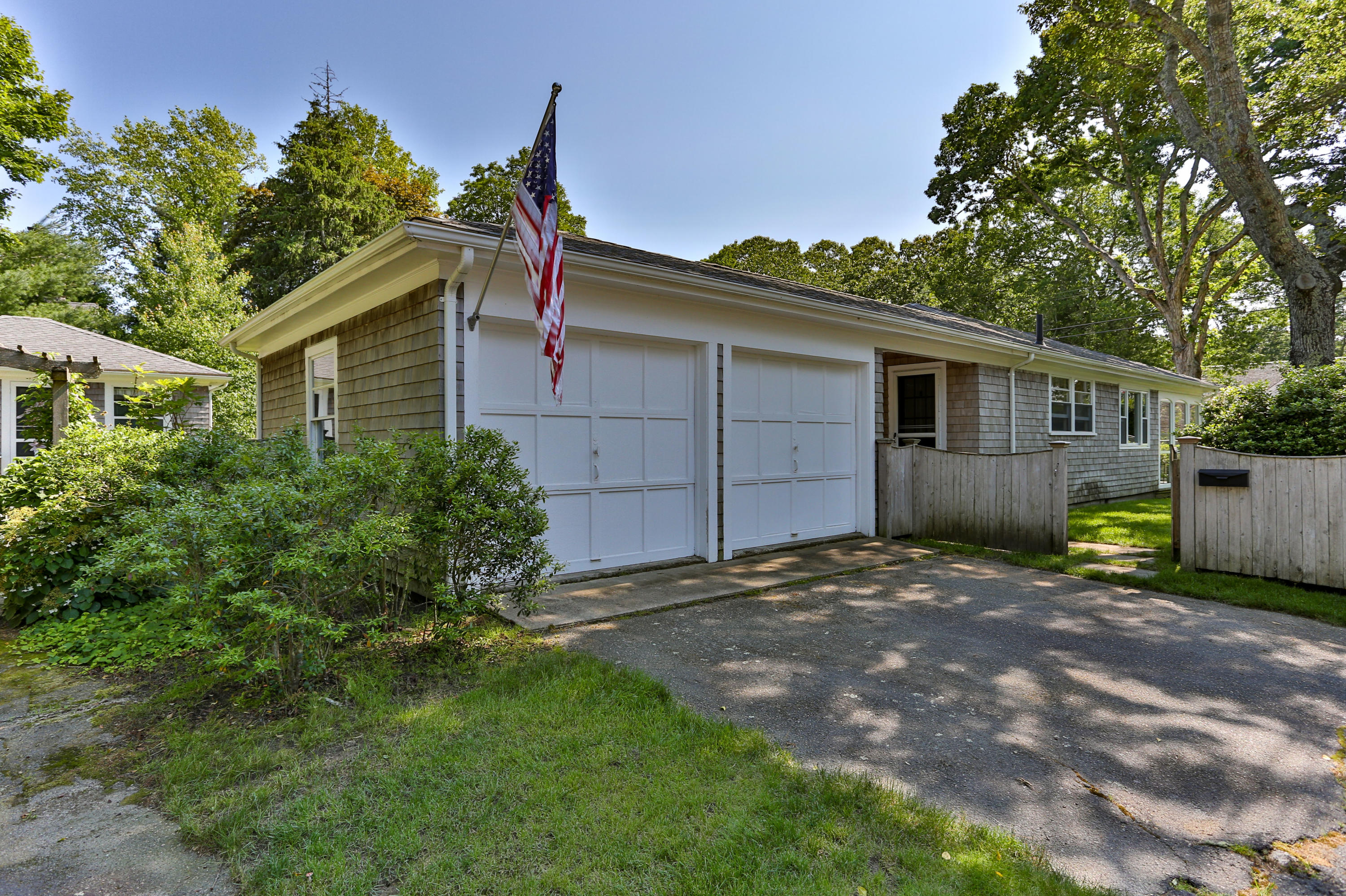 256 Parker Road Osterville, MA 02655 - Photo 19 of 22 front view of a house with a yard