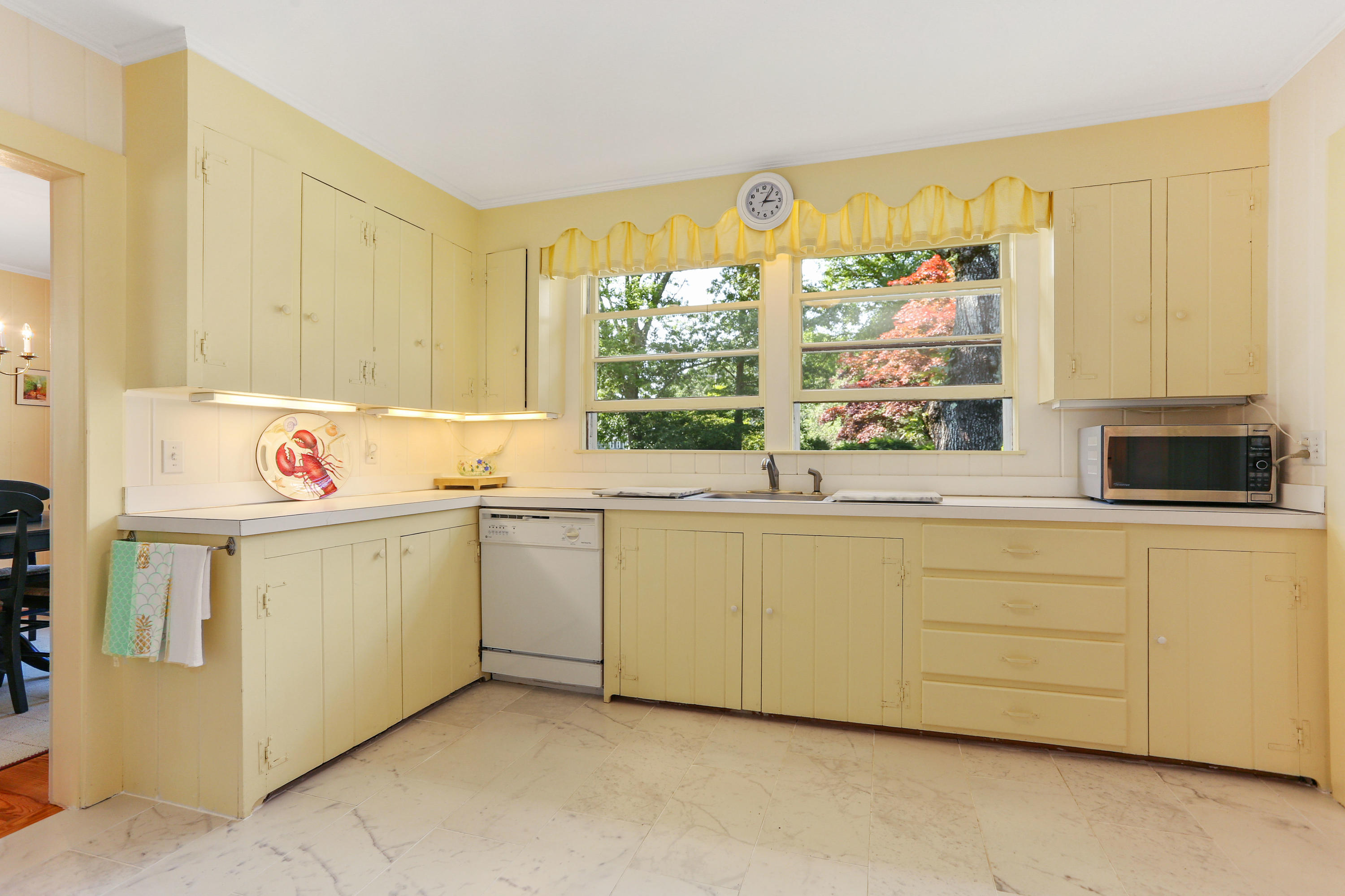 256 Parker Road Osterville, MA 02655 - Photo 9 of 22 a utility room with stainless steel appliances a white cabinets and a window