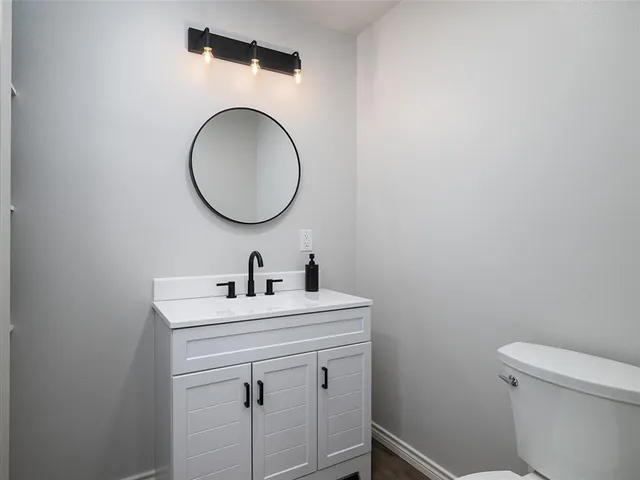 a kitchen with stainless steel appliances granite countertop a stove a microwave and a refrigerator