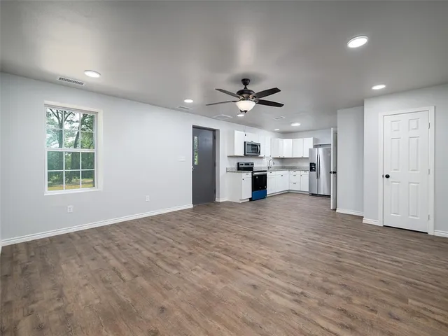 a view of outdoor space with deck and trees