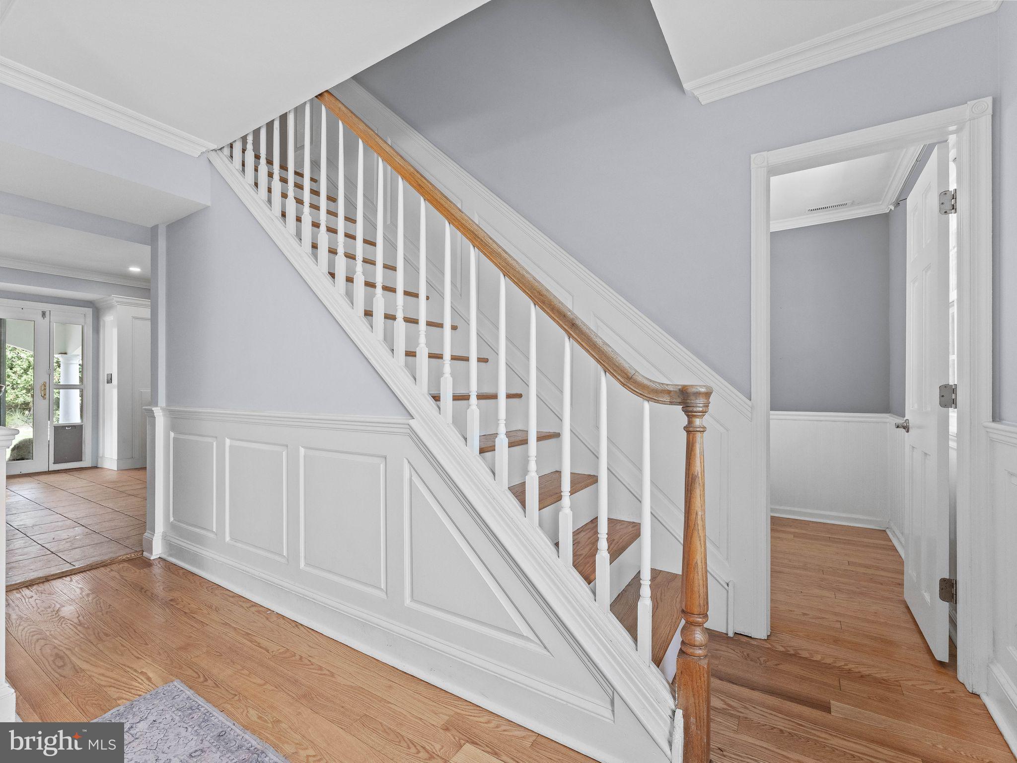 8 Chesterfield Road Sewell, NJ 08080 - Photo 6 of 57 a view of staircase with lots of frames on wall and wooden floor