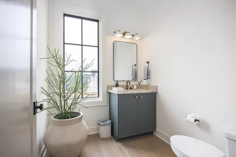 a utility room with cabinets washer and dryer