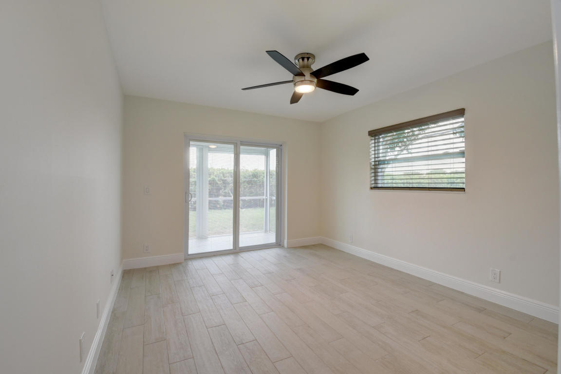 76 Flanders B Delray Beach, FL 33484 - Photo 15 of 35 a view of an empty room with a window