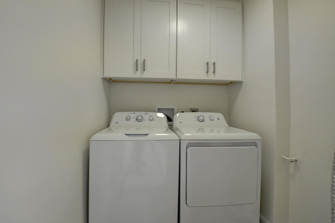 76 Flanders B Delray Beach, FL 33484 - Photo 18 of 35 a utility room with dryer and washer