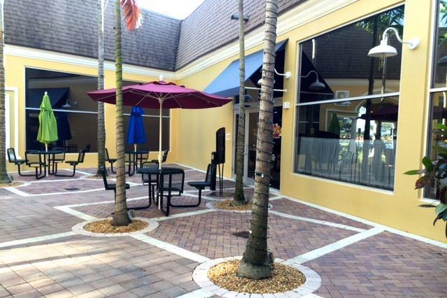 76 Flanders B Delray Beach, FL 33484 - Photo 30 of 35 a outdoor view of a building with traffic signal lights