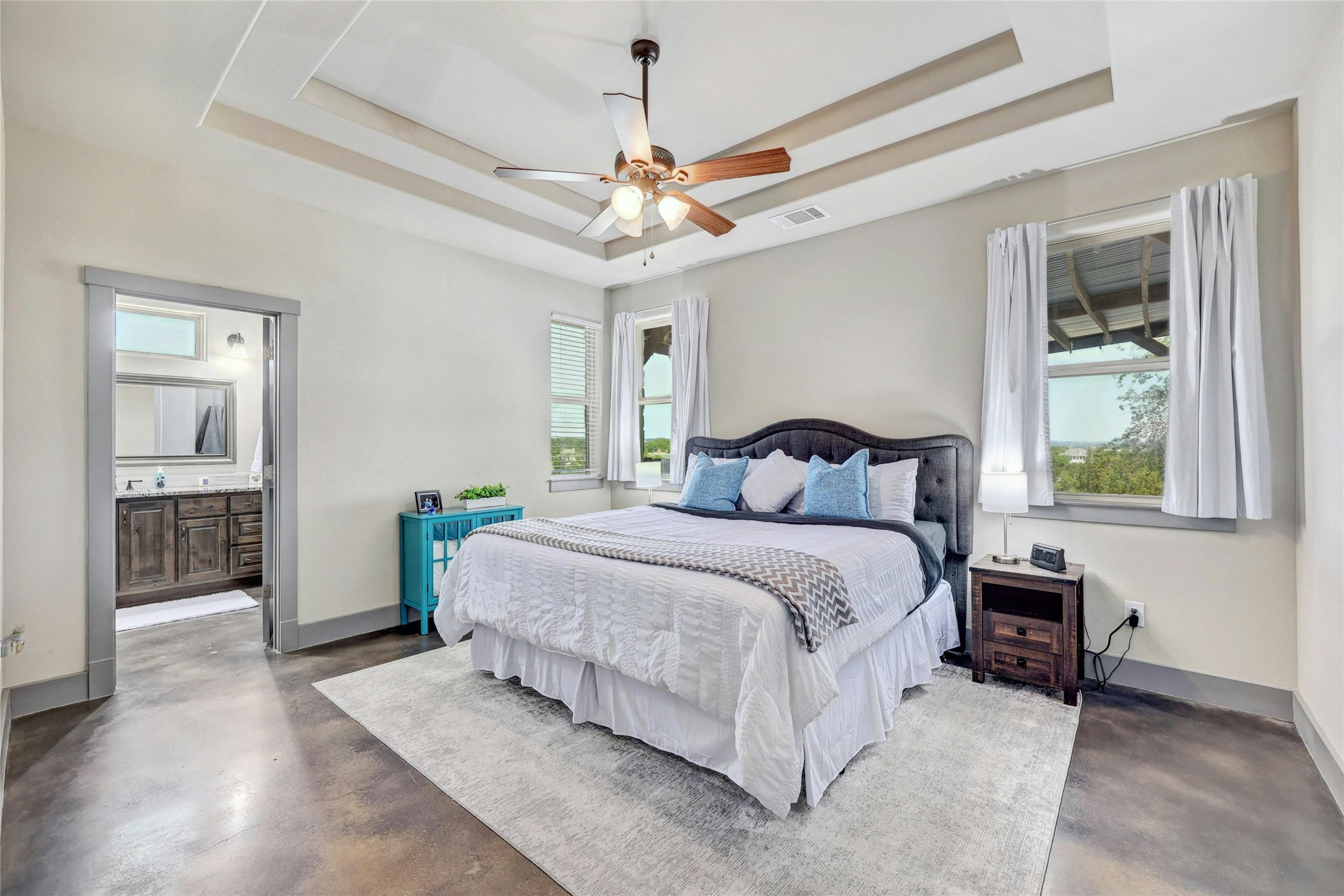 20117 Haystack Cove Spicewood, TX 78669 - Photo 17 of 40 The primary bedroom is large and has gorgeous tray ceilings.