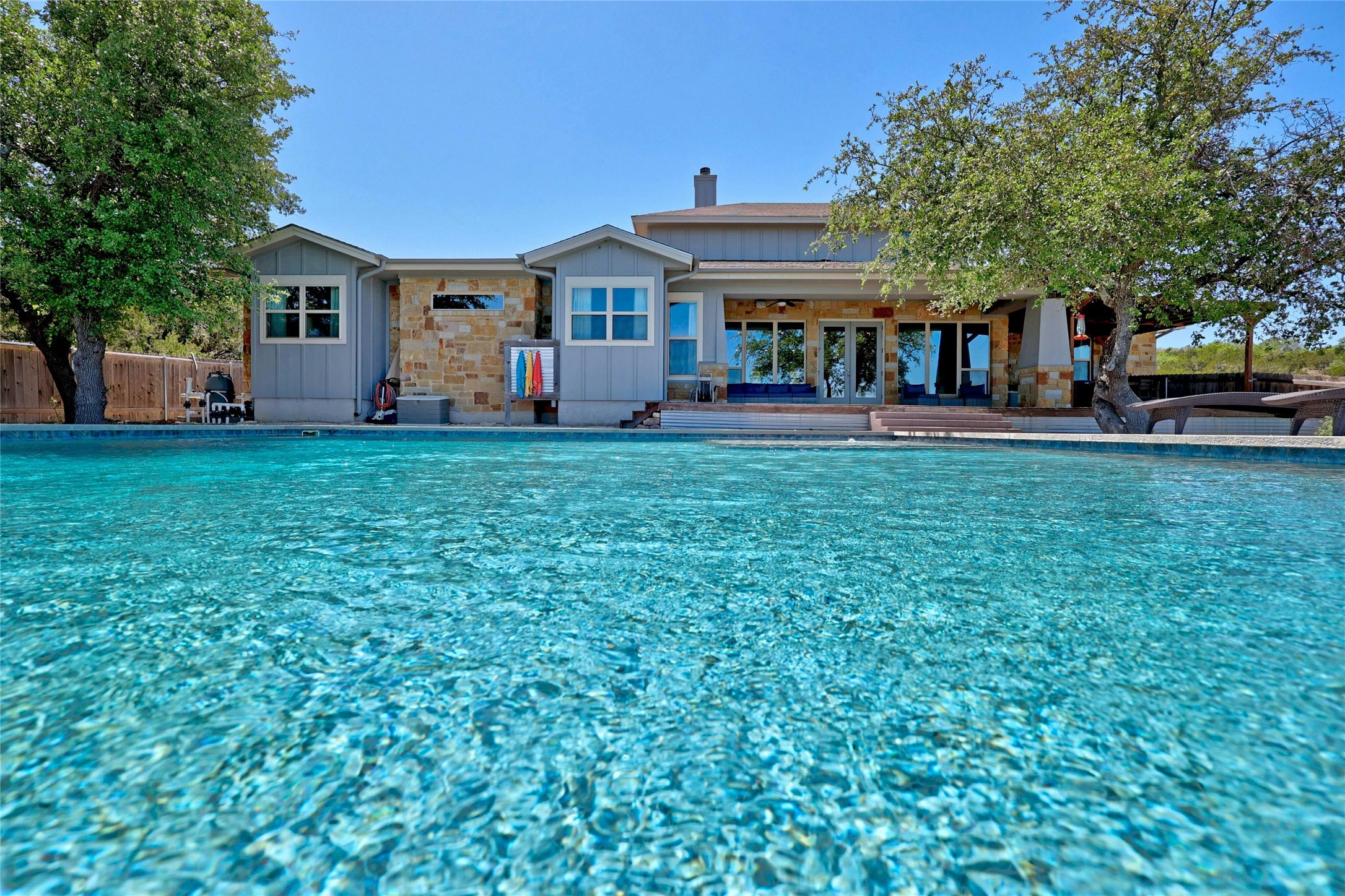 20117 Haystack Cove Spicewood, TX 78669 - Photo 2 of 40 Summers just got even better! Stay cool all summer long in this sparkling pool with negative edge that overlooks the VIEW.