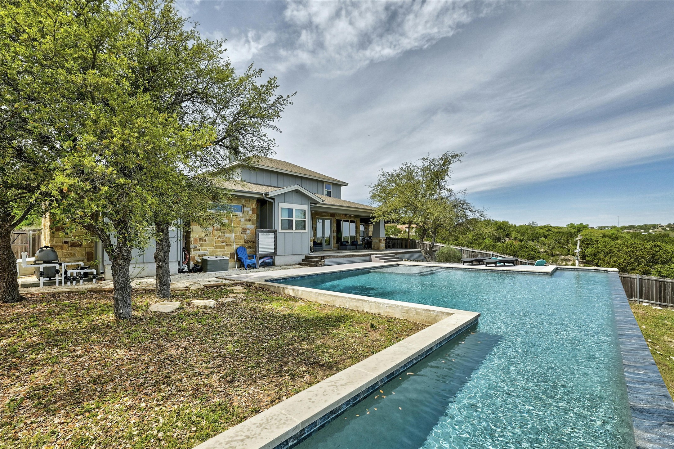 20117 Haystack Cove Spicewood, TX 78669 - Photo 32 of 40 A negative edge allows you to swim right up to the view for an up close and personal look. Intelligently designed pool allows for lap swimming, as well.