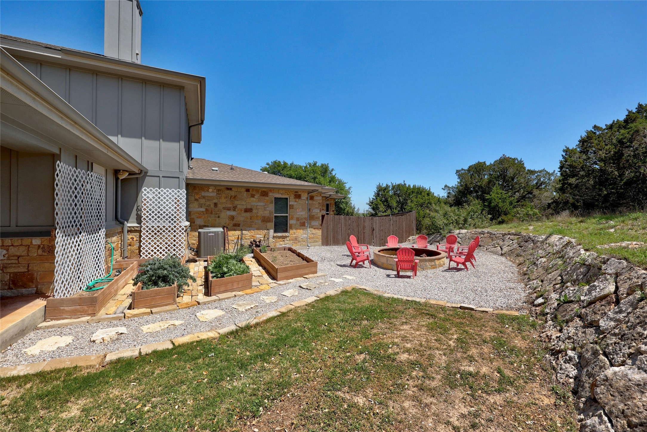 20117 Haystack Cove Spicewood, TX 78669 - Photo 33 of 40 Make the MOST of this land and space, you can enjoy roasting marshmallows or telling stories around the stone firepit. Raised garden beds allow for growing your own vegetables with ease!