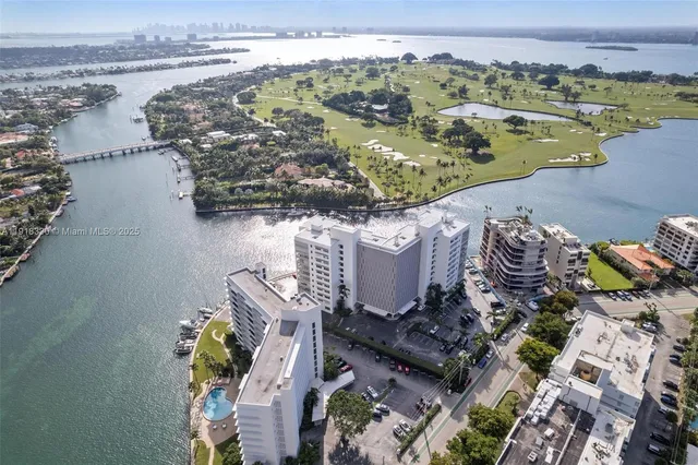 an aerial view of a house with a lake view