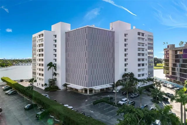 an aerial view of residential house with outdoor space and swimming pool
