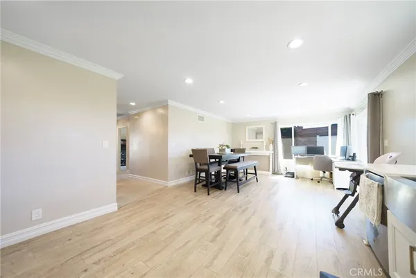 a view of a dining room with furniture window and wooden floor