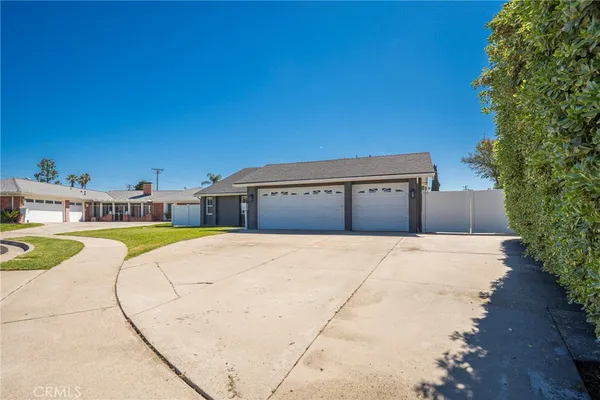 a view of swimming pool with outdoor seating and plants