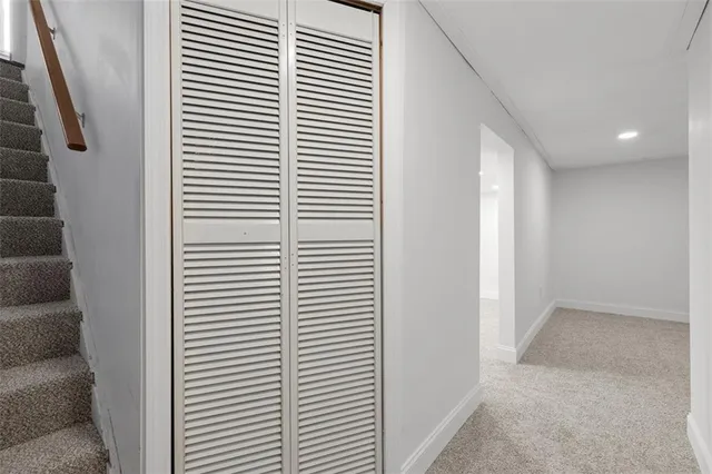 a view of a hallway with windows