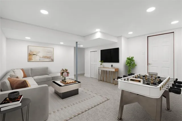 a living room with furniture a flat screen tv and white cabinet