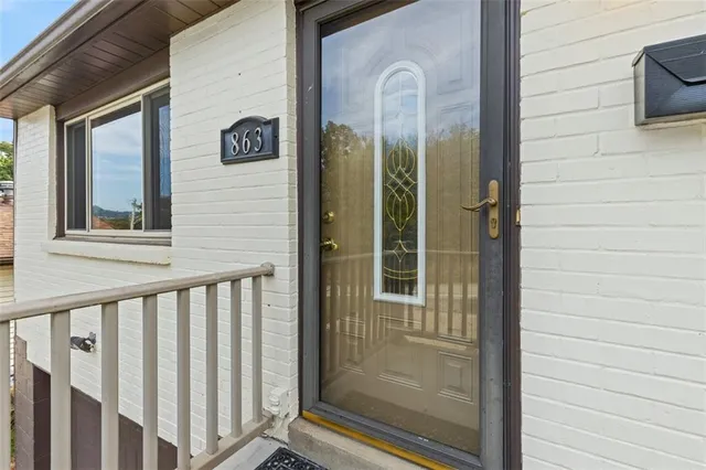 a view of a door and a window