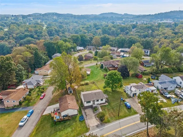 an aerial view of a house with a garden