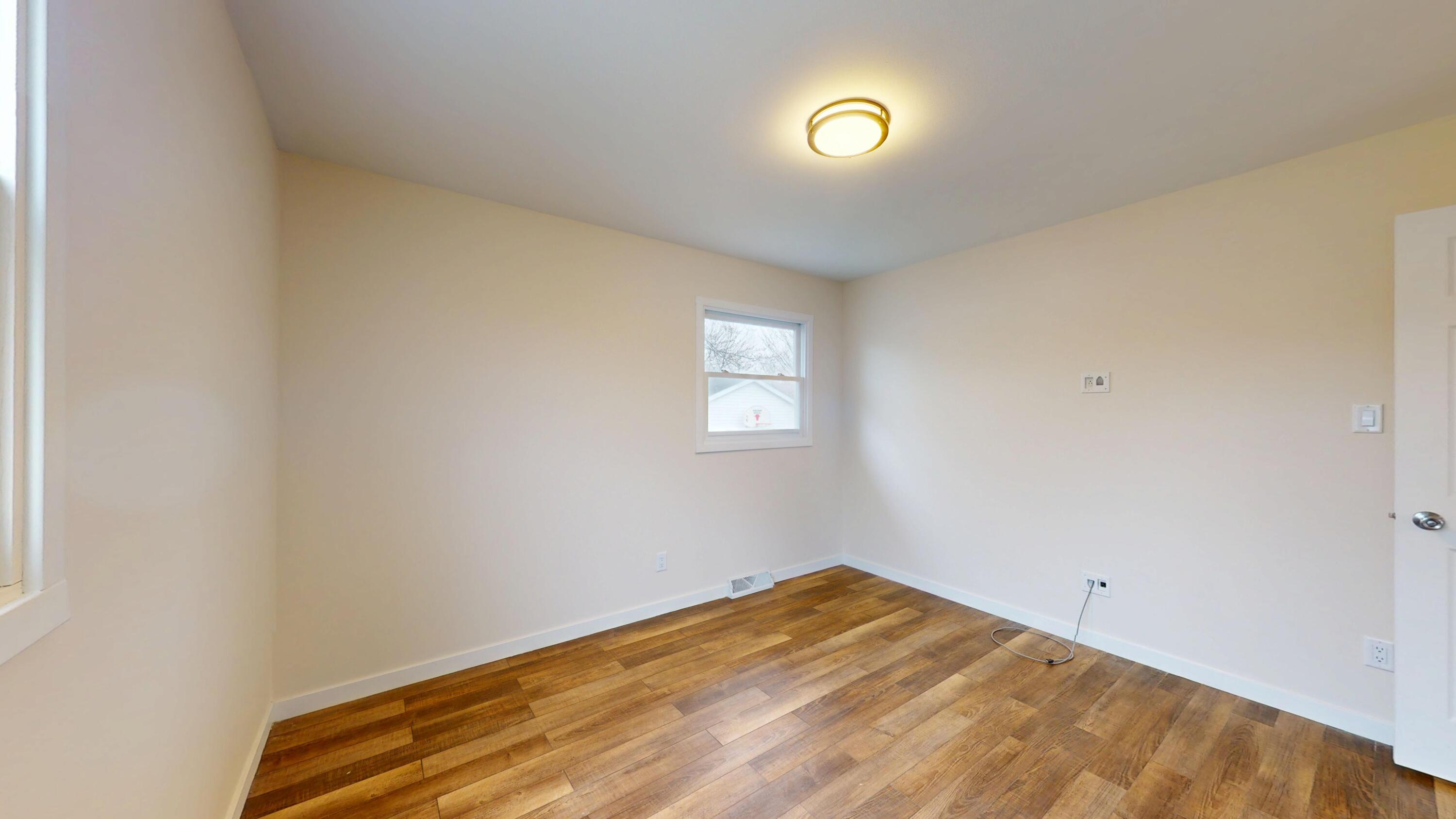 317 Redpath Avenue Michigan City, IN 46360 - Photo 11 of 40 a view of a room with a window