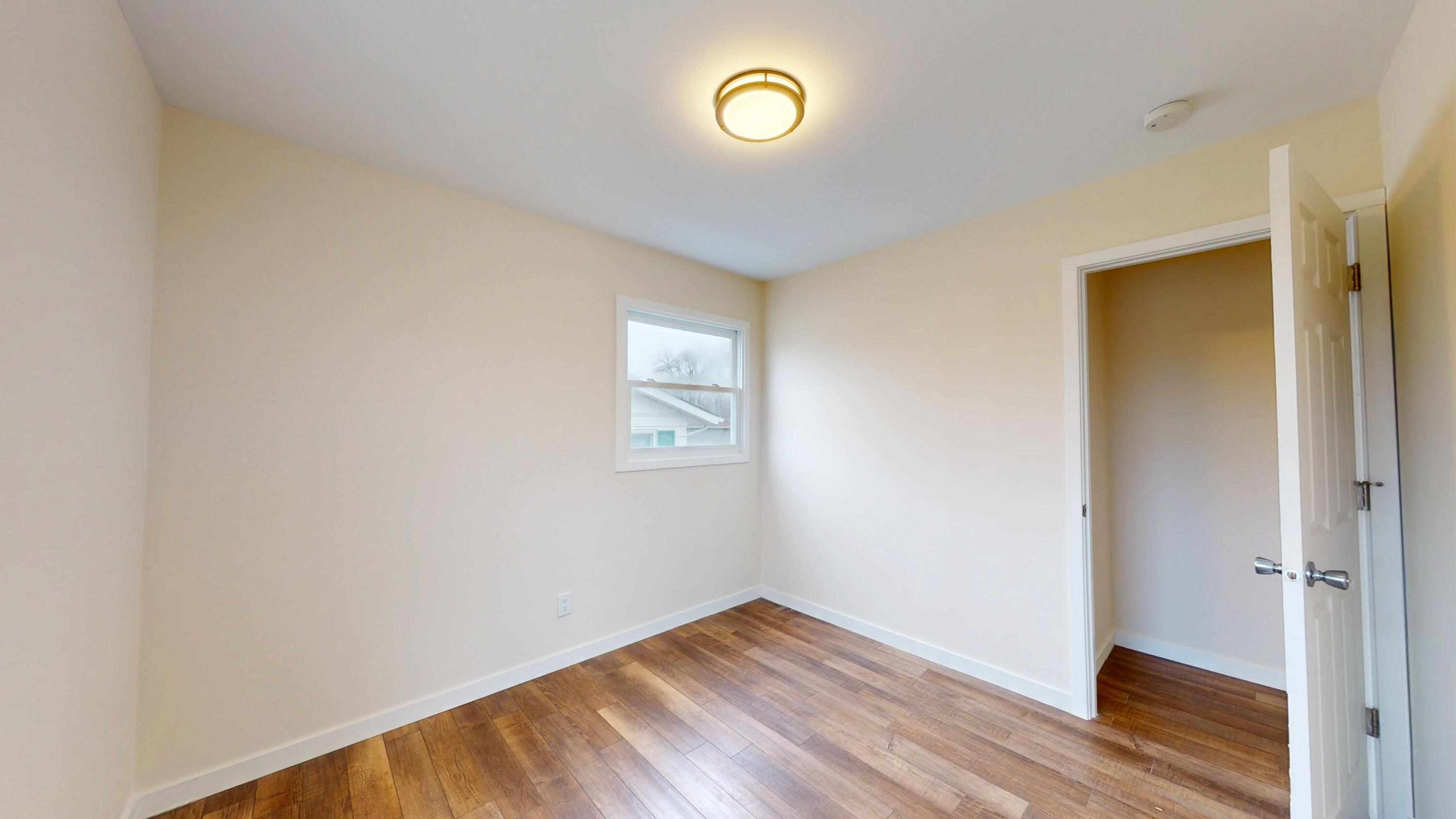 317 Redpath Avenue Michigan City, IN 46360 - Photo 14 of 40 a view of room with wooden floor