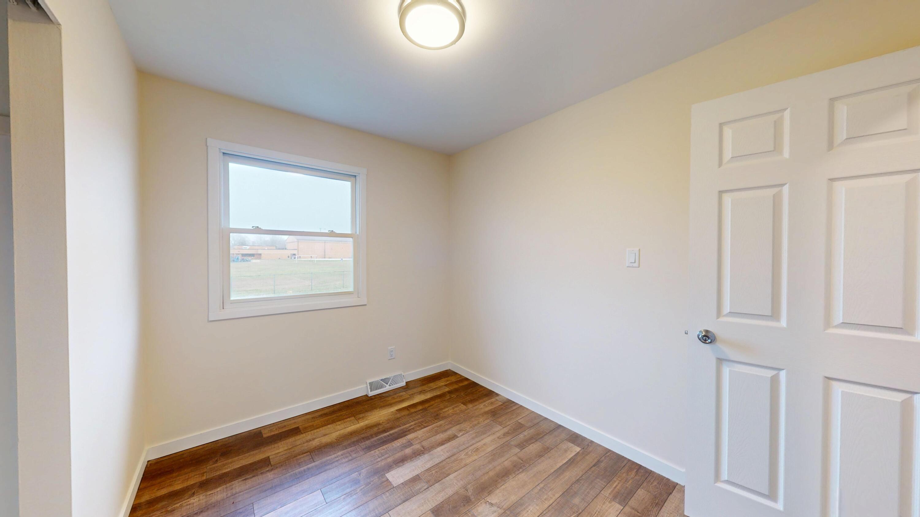 317 Redpath Avenue Michigan City, IN 46360 - Photo 16 of 40 an empty room with windows